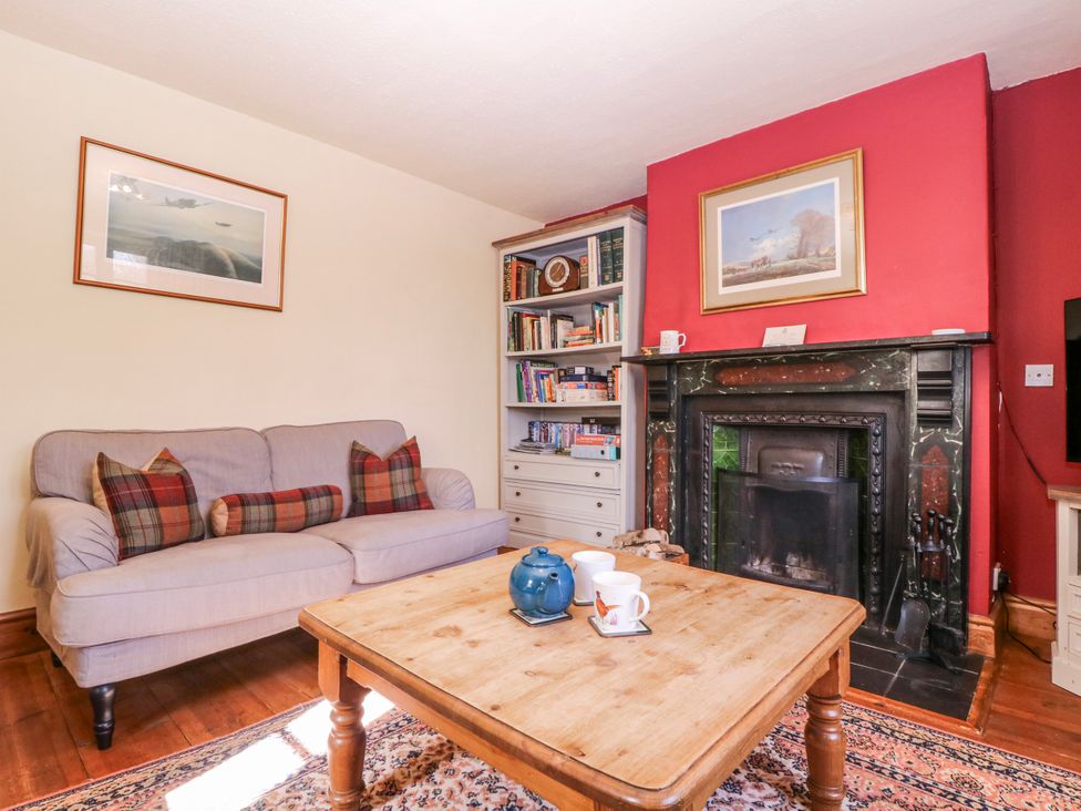 A living room with a sofa and a coffee table at Elm View Chipping Campden