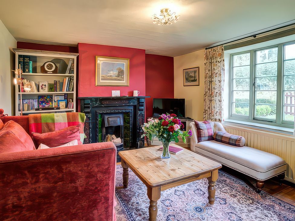 A living room with a sofa and a coffee table at Elm View Chipping Campden