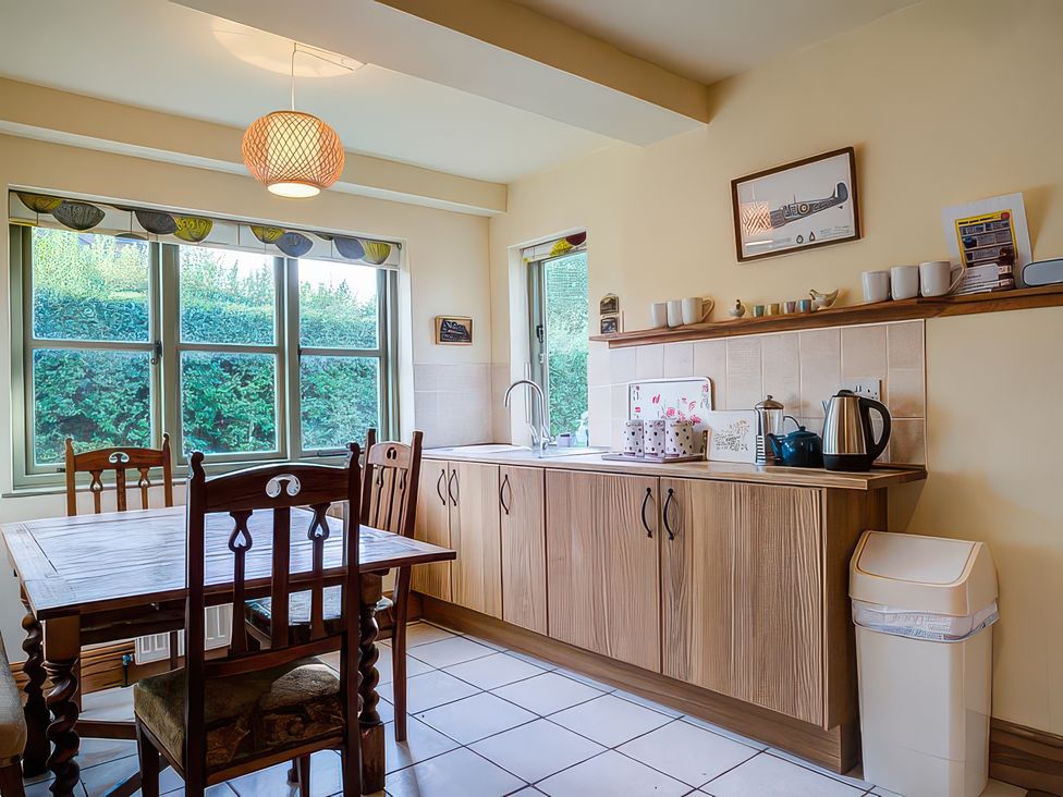 A kitchen with a table and chairs at Elm View in Chipping Campden