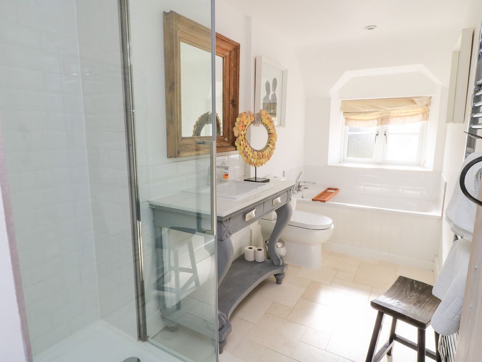 A bathroom with a shower, sink, and toilet at Fairview Cottage in Milton-Under-Wychwood