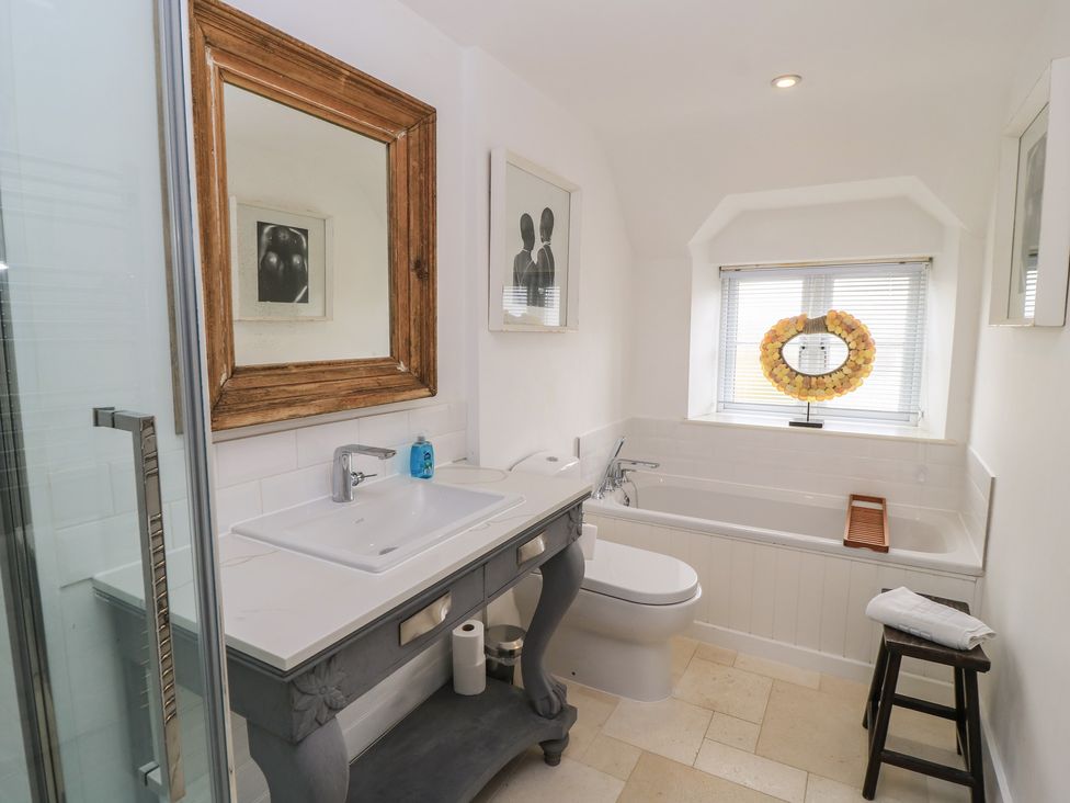 A bathroom with a shower, sink, and bathtub at Fairview Cottage in Milton-Under-Wychwood