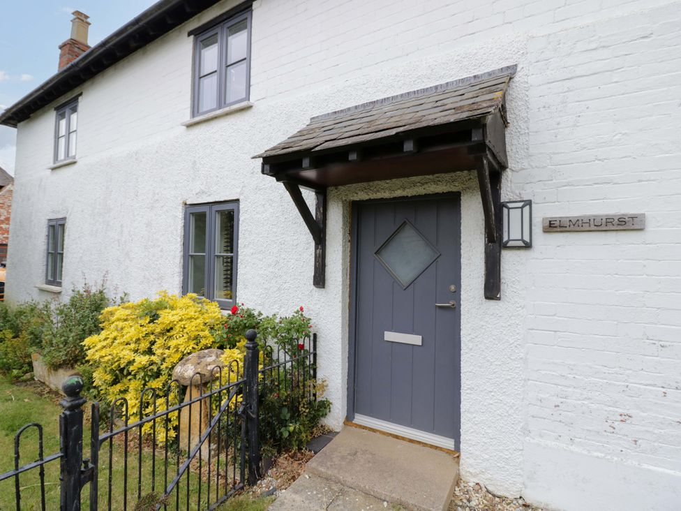 An entryway with a door and window at Elmhurst Cottage Lower Quinton