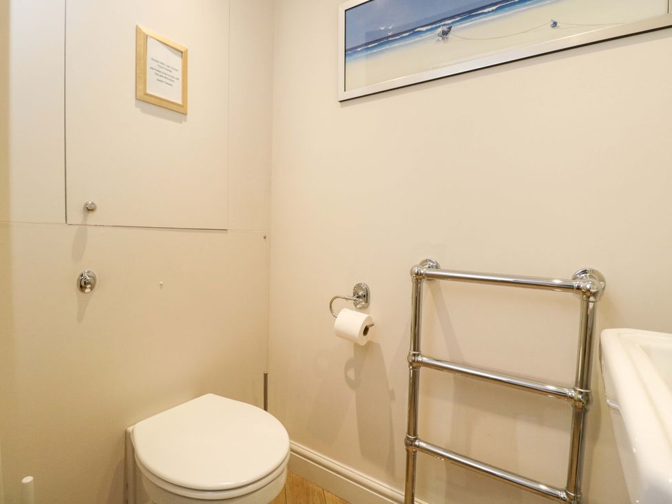 A bathroom with a toilet and towel rail at Church View in Bourton-On-The-Water