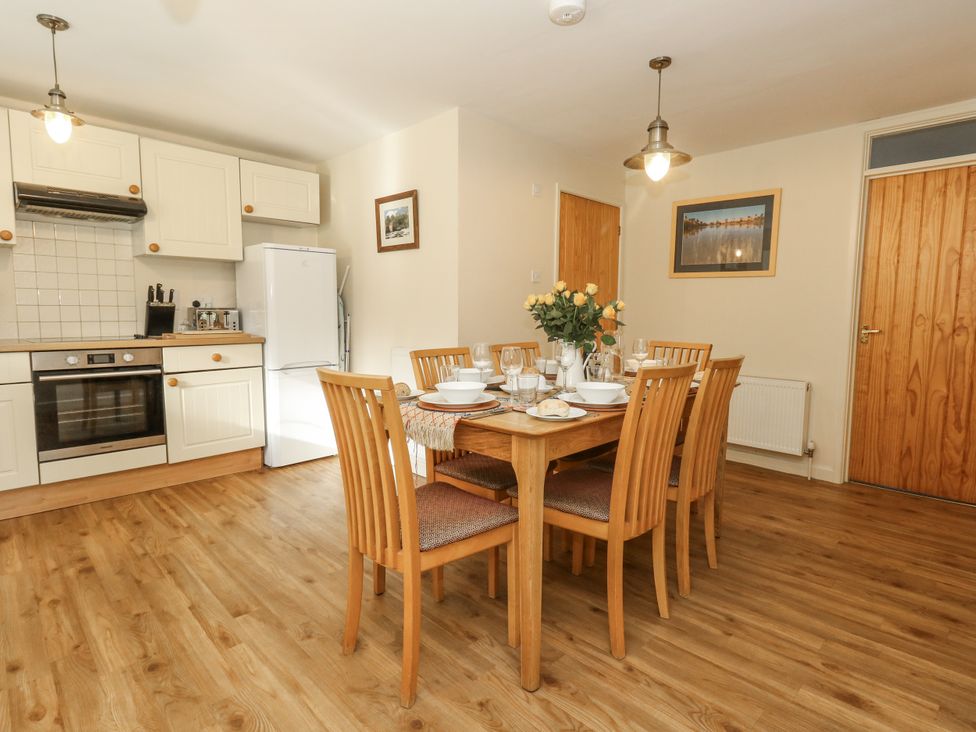 A dining room with a table set for meal at Droop Farm Cottage Droop near Hazelbury Bryan