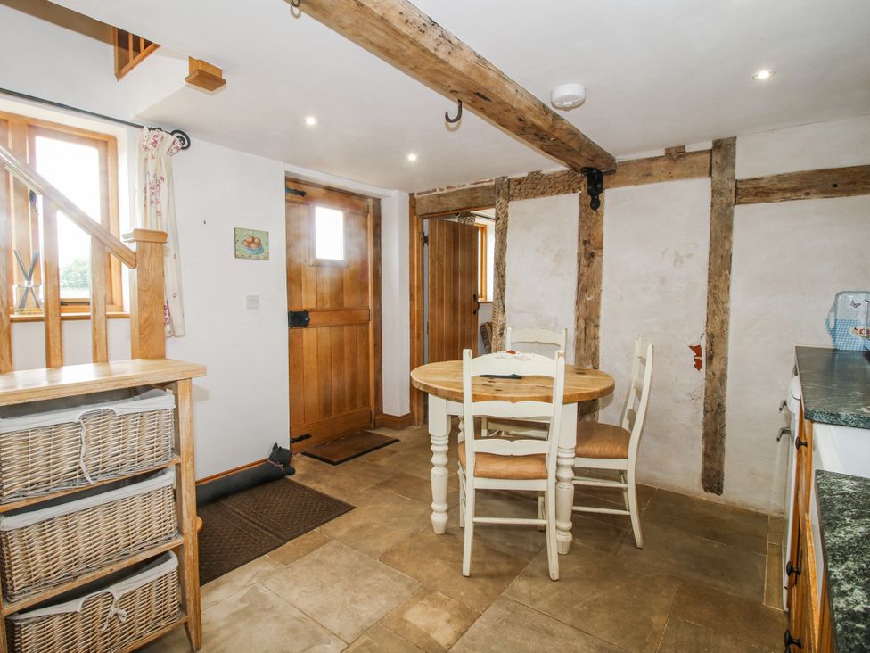 A dining room with a table and chairs at The Shooting Folly in Cheswardine