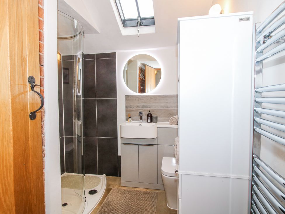 A bathroom with a shower, sink, and toilet at The Shooting Folly in Cheswardine