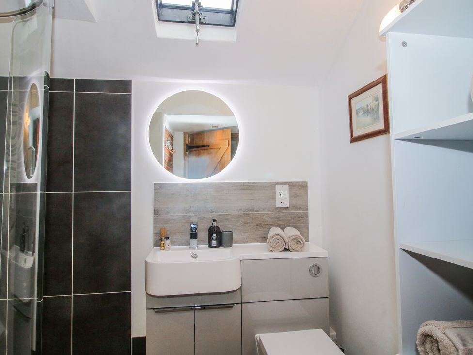 A bathroom with a shower and sink at The Shooting Folly in Cheswardine