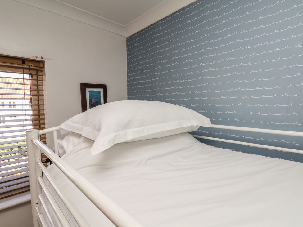 A bedroom with a bed and a window at Haven House in Whitby