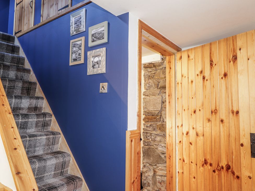 A hallway with staircase and door at 83 Seatown Cullen