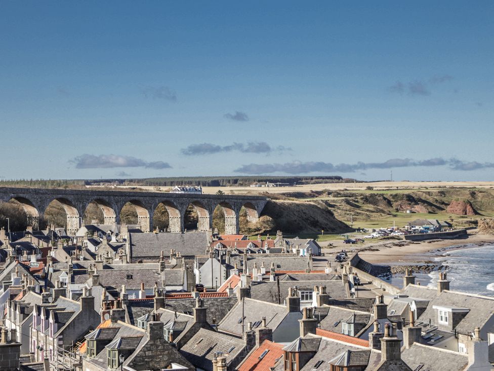 A view of houses and a viaduct near the coast at 83 Seatown in Cullen