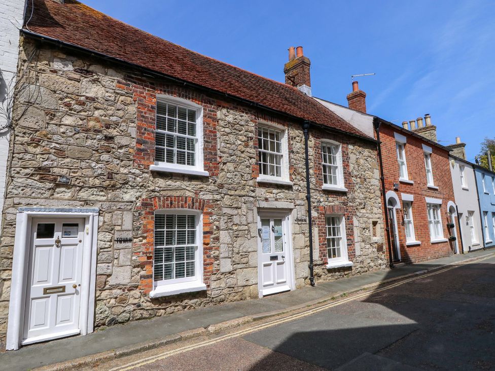 A street view of houses with stone and brick facades at Tovah in Yarmouth