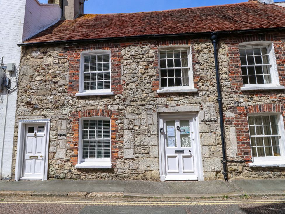 A stone house with windows and a door at Tovah in Yarmouth