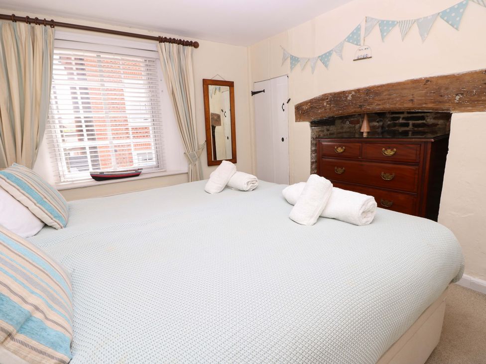A bedroom with a double bed and a dresser at Tovah in Yarmouth
