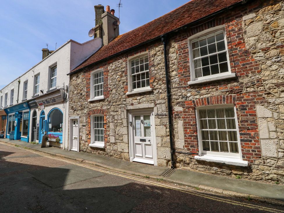 A street view of buildings with brick and stone facades at Tovah in Yarmouth