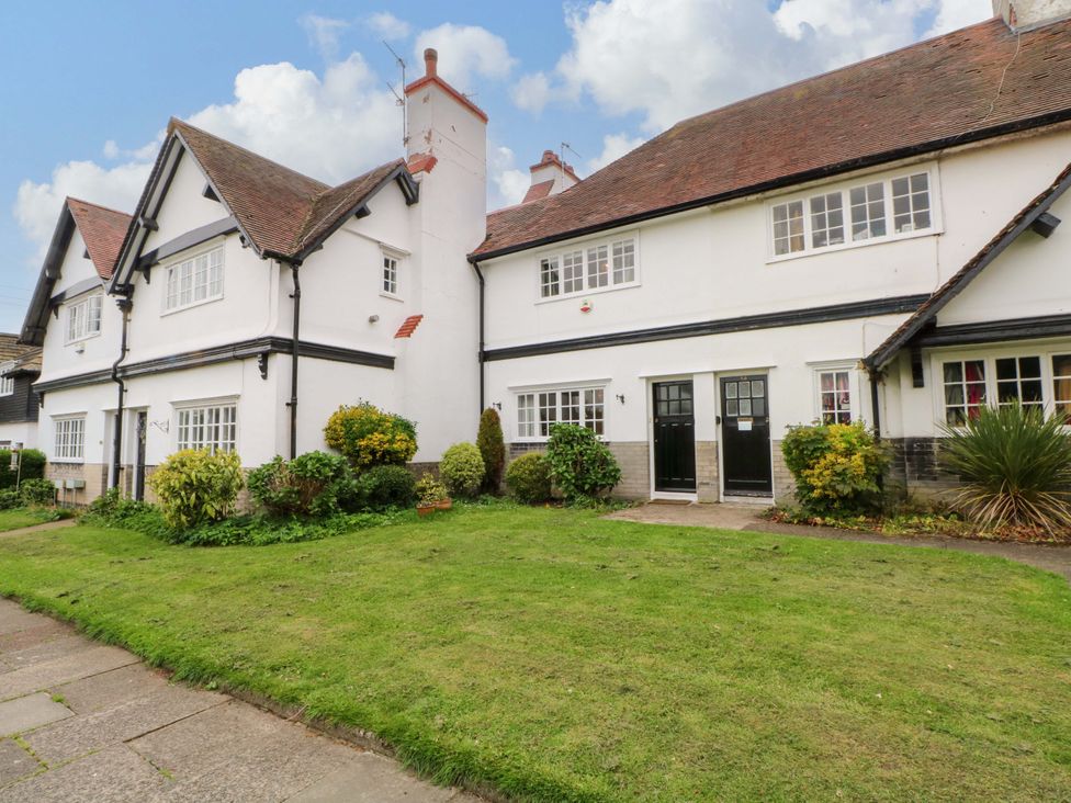 A house with a garden and walkway at Sunlight Soap Cottage in Port Sunlight