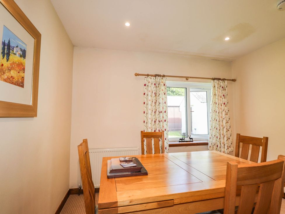 A dining room with a table and chairs at St. Aethans in Bonar Bridge