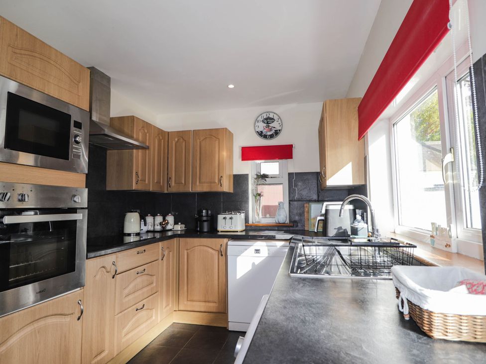 A kitchen with cabinets and appliances at St. Aethans Bonar Bridge