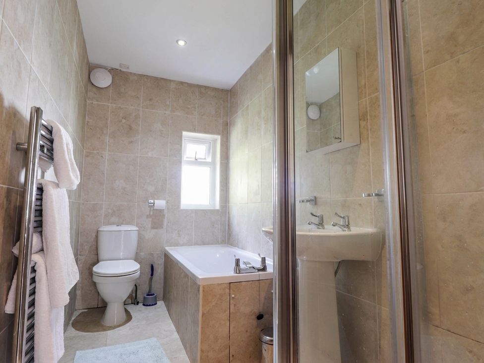 A bathroom with a bathtub and toilet at St. Aethans, Bonar Bridge