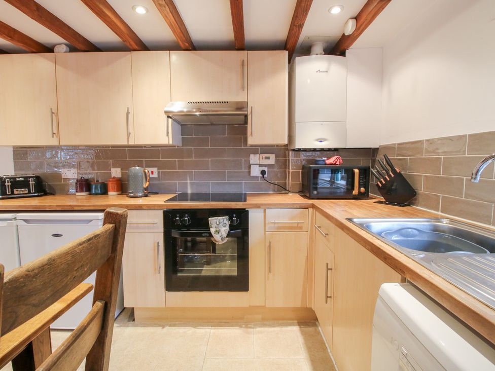 A kitchen with appliances and utensils at Old Hall Barn 4 Church Stretton