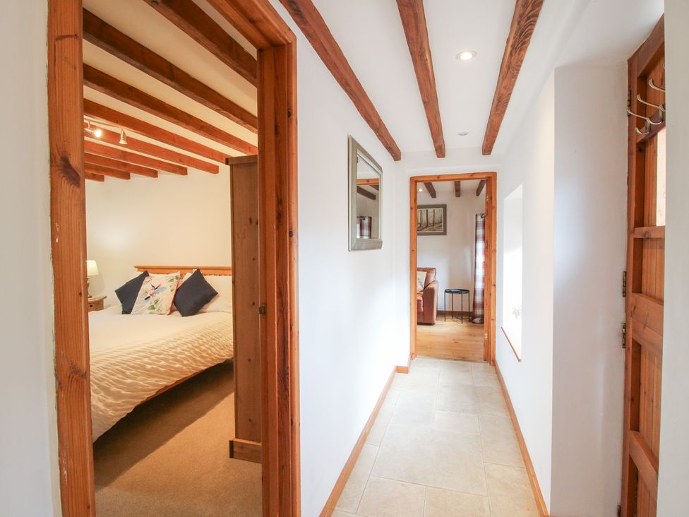 A hallway with doors leading to rooms at Old Hall Barn 4 Church Stretton