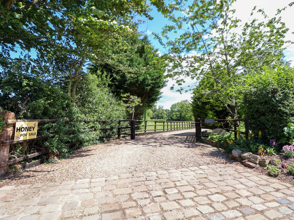 A gravel path leading to a gate at Honey for Sale in Tarporley