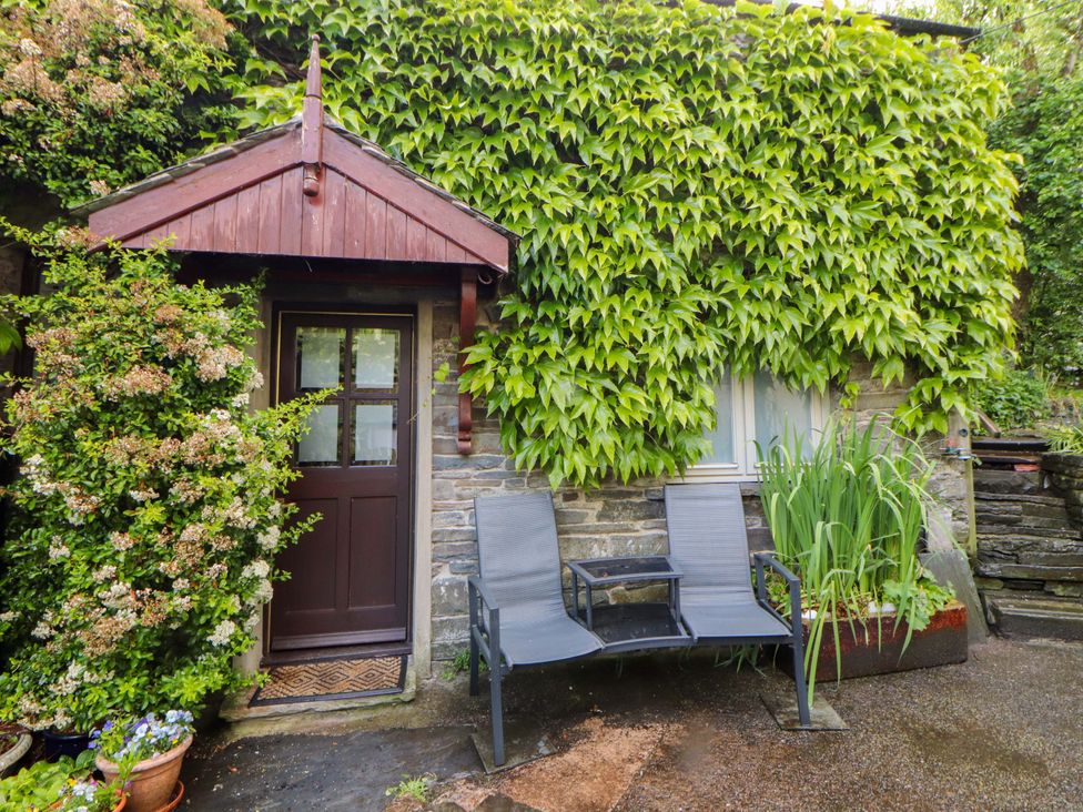 An outdoor area with a door and seating at Holemire Barn in Lorton