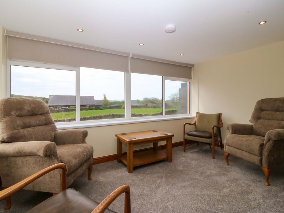 A snug with chairs and a table at Dalar Deg Aberdaron