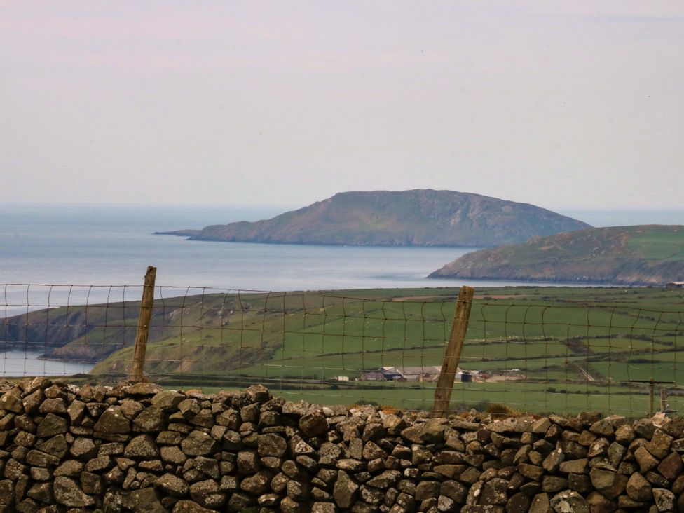 A view of a coastal landscape with an island in the distance at Dalar Deg Aberdaron