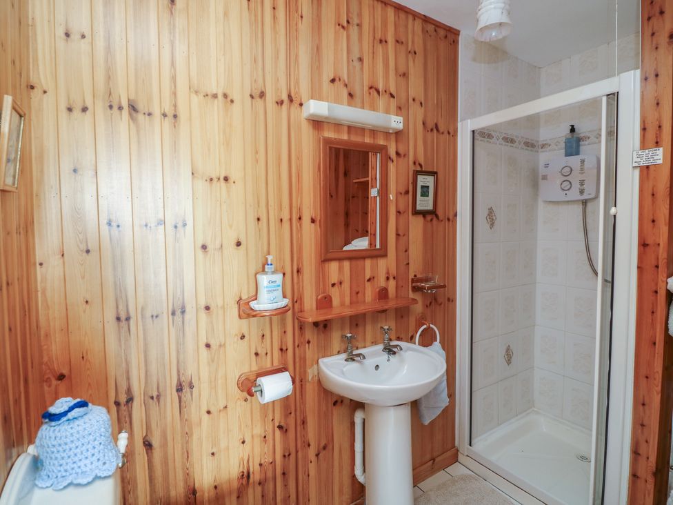 A bathroom with a sink and shower at Cairbre House in Dungarvan, County Waterford