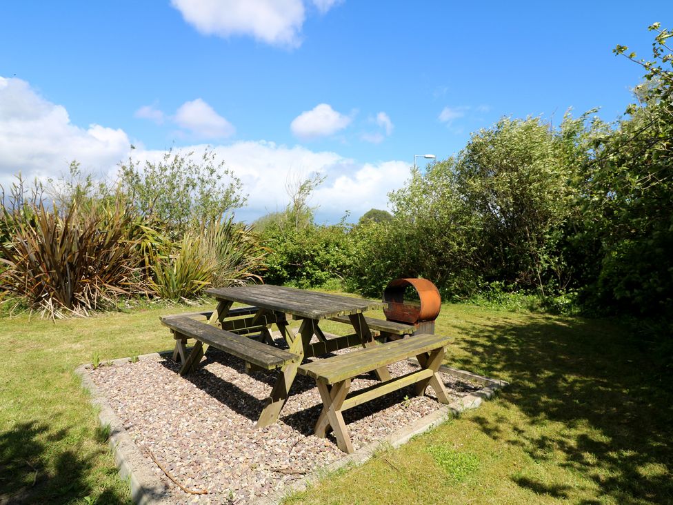 A table and benches in a garden at Cairbre House, Dungarvan, County Waterford