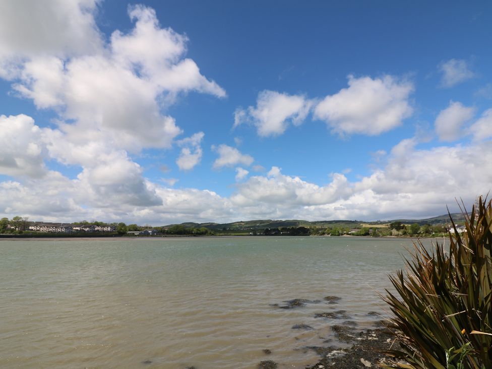A view of water and clouds with nearby houses at Cairbre House Dungarvan, County Waterford
