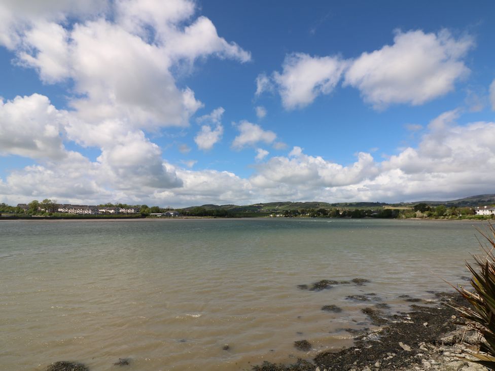 A view of water and land with houses in the background at Cairbre House, Dungarvan, County Waterford