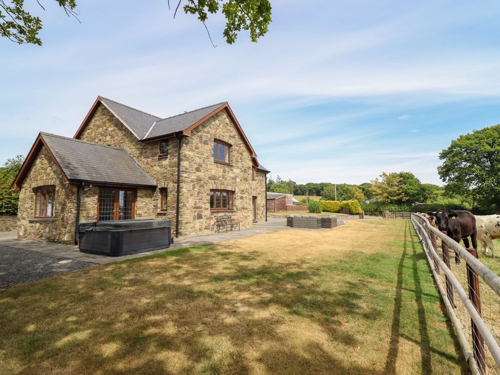A house with a hot tub and patio in Caersws at Ty Berllan