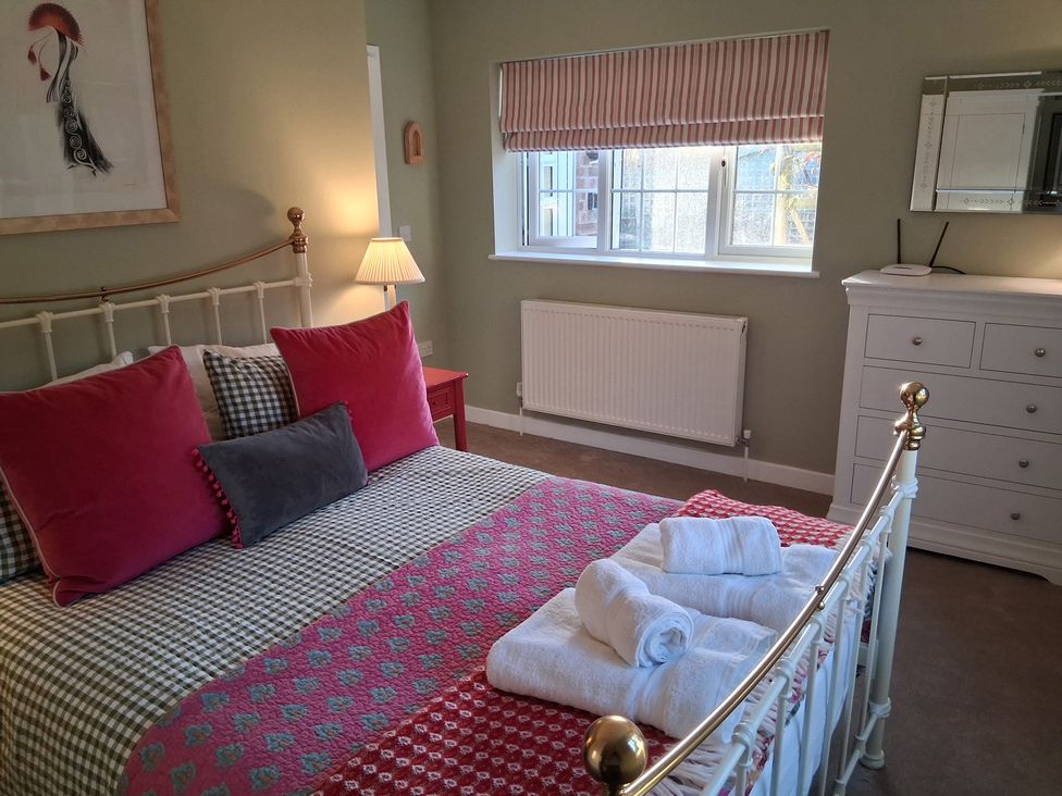 A bedroom with a bed and a dresser at Little Retreat in Upwey