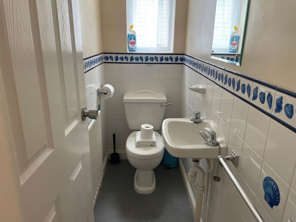 A bathroom with a toilet and sink at Mutiny House Brewers Quay Harbour