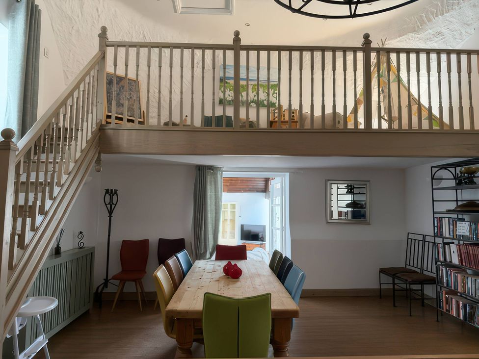 A dining room with a table and chairs at The Oast House in Brewers Quay Harbour