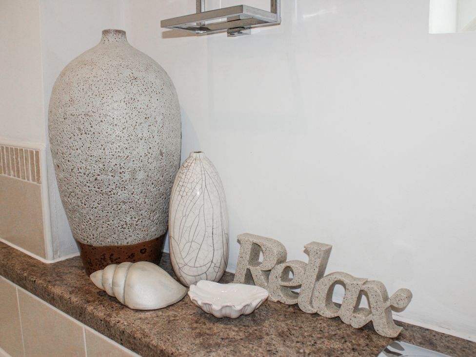 A decorative arrangement with vases and shells at Estuary View in Kingsbridge