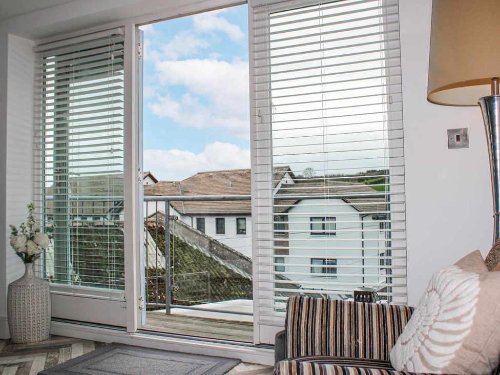 A living room with a view of the outdoors at Estuary View in Kingsbridge