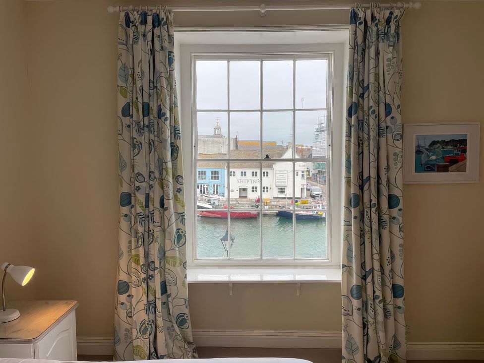 A view from a bedroom window overlooking the waterfront at Safe Harbour in Brewers Quay harbour