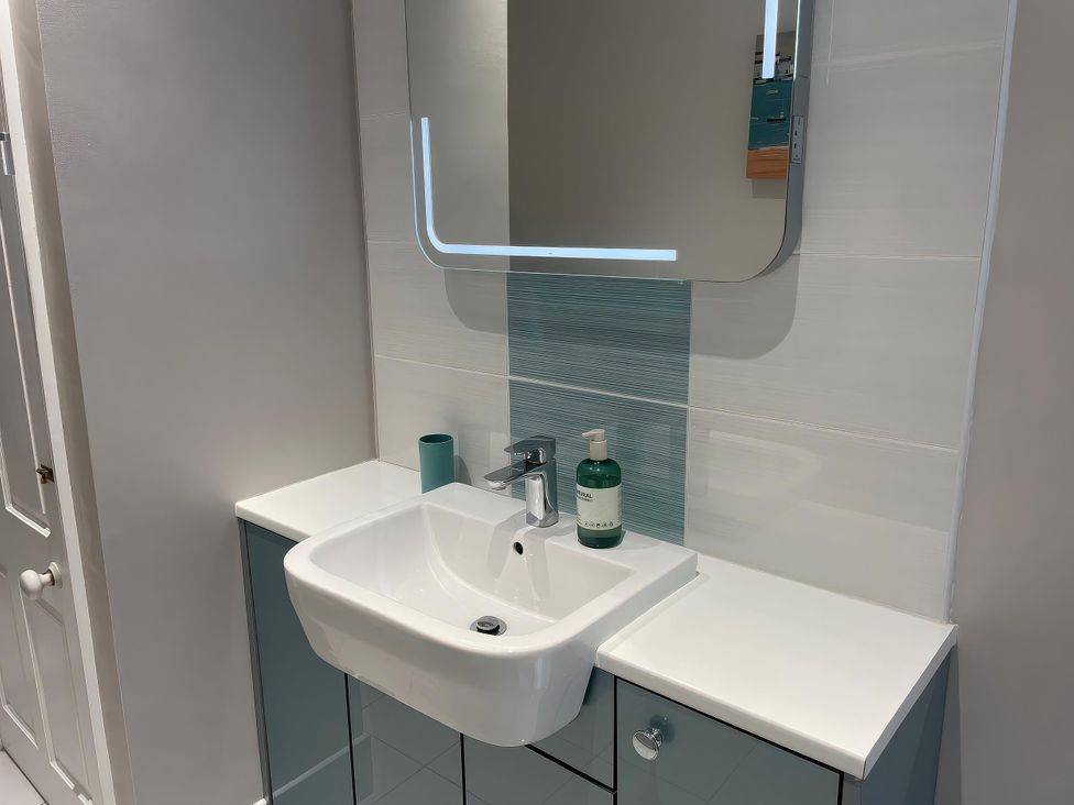 A bathroom with a sink and mirror at Safe Harbour in Brewers Quay harbour