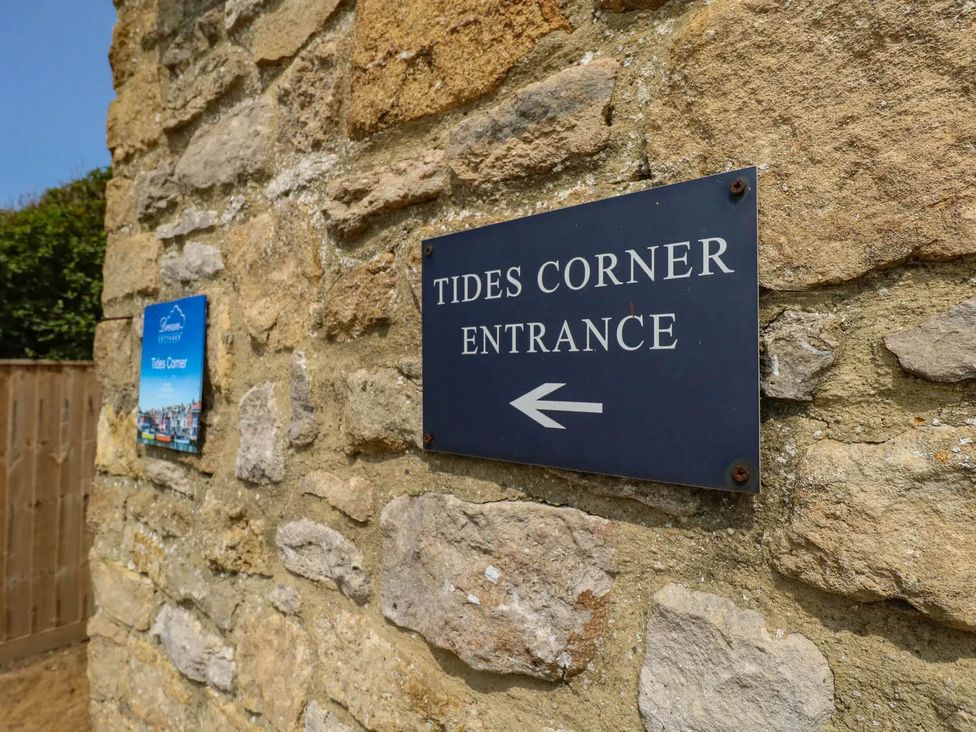 A sign indicating the entrance to Tides Corner at Bowleaze