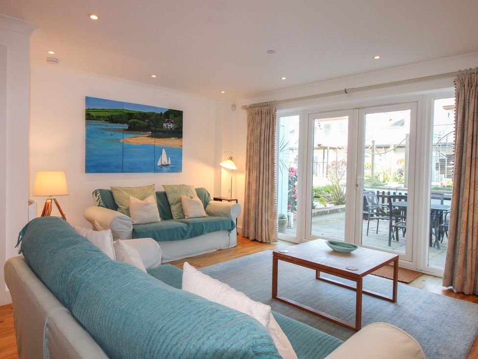 A living room with a sofa and coffee table at 16 Bolt Head in Salcombe