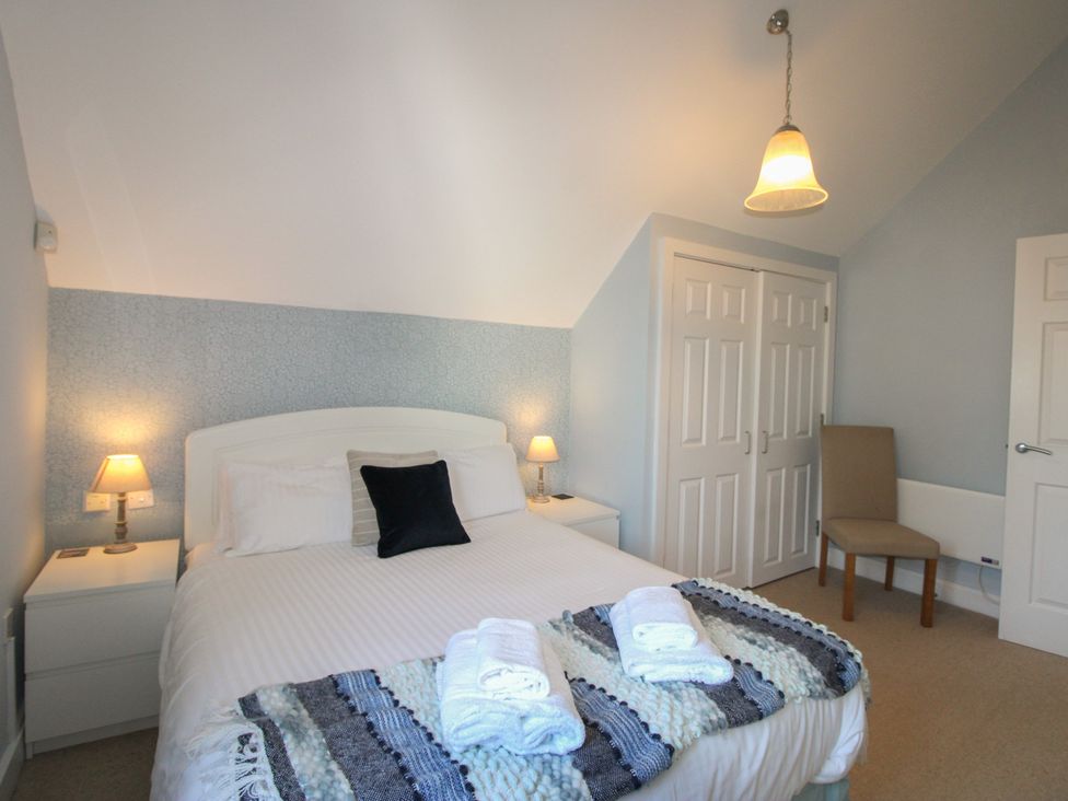 A bedroom with a double bed and nightstands at 16 Bolt Head Salcombe