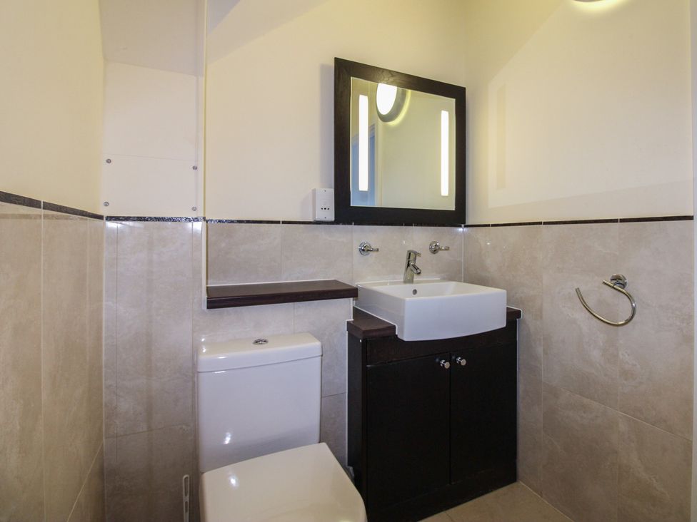 A bathroom with a sink and toilet at 16 Bolt Head in Salcombe