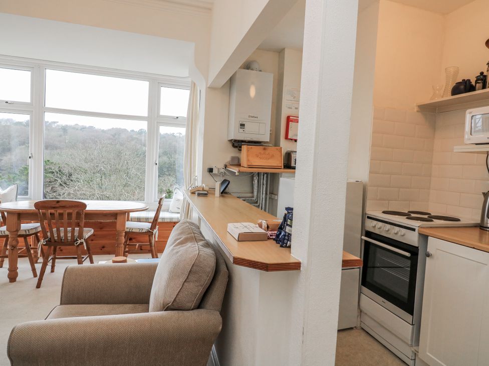 A kitchen with dining area and appliances at 1 Hazeldene Salcombe