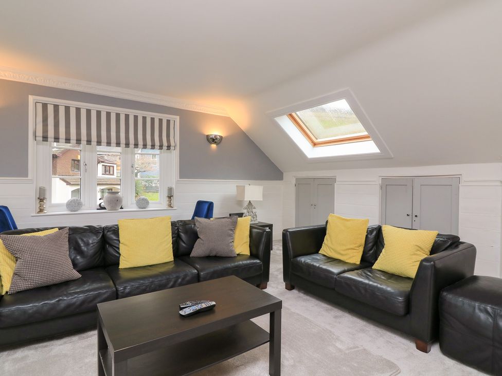 A living room with sofas and a coffee table at 1 The Old Coach House in Dartmouth