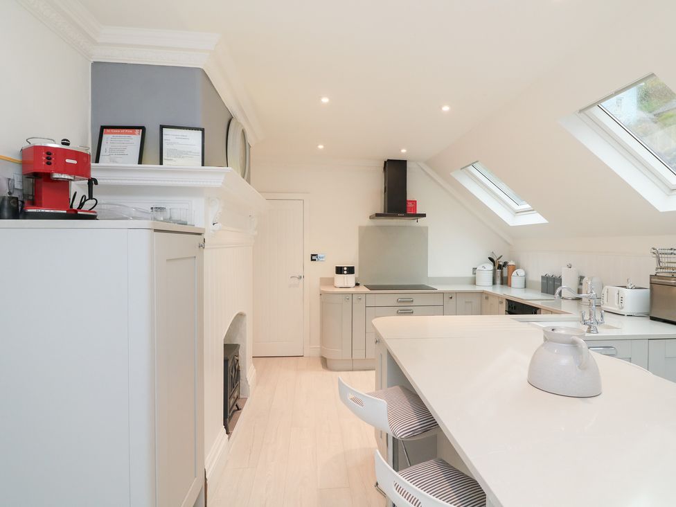A kitchen with stove and cabinets at 1 The Old Coach House Dartmouth