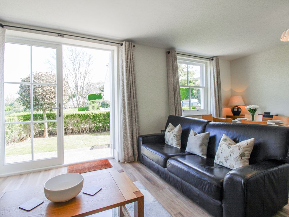 A living room with a sofa and coffee table at 3 Combehaven Salcombe