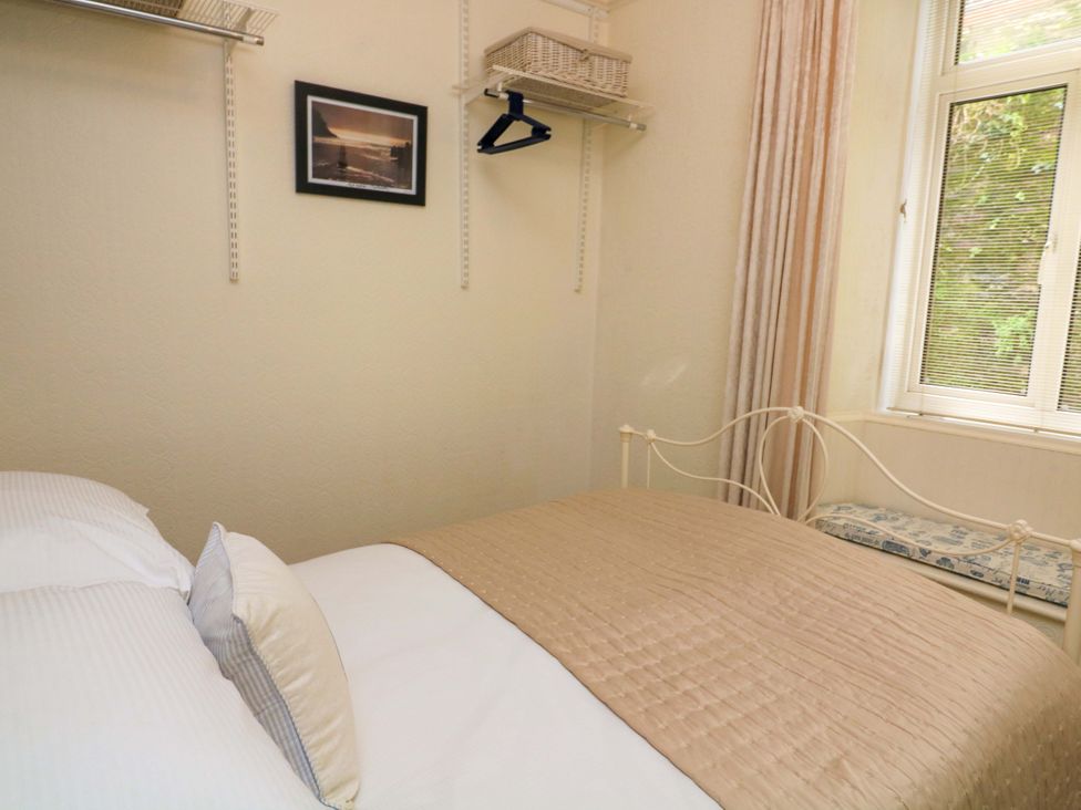 A bedroom with a bed and window at 3 Dartview Dartmouth