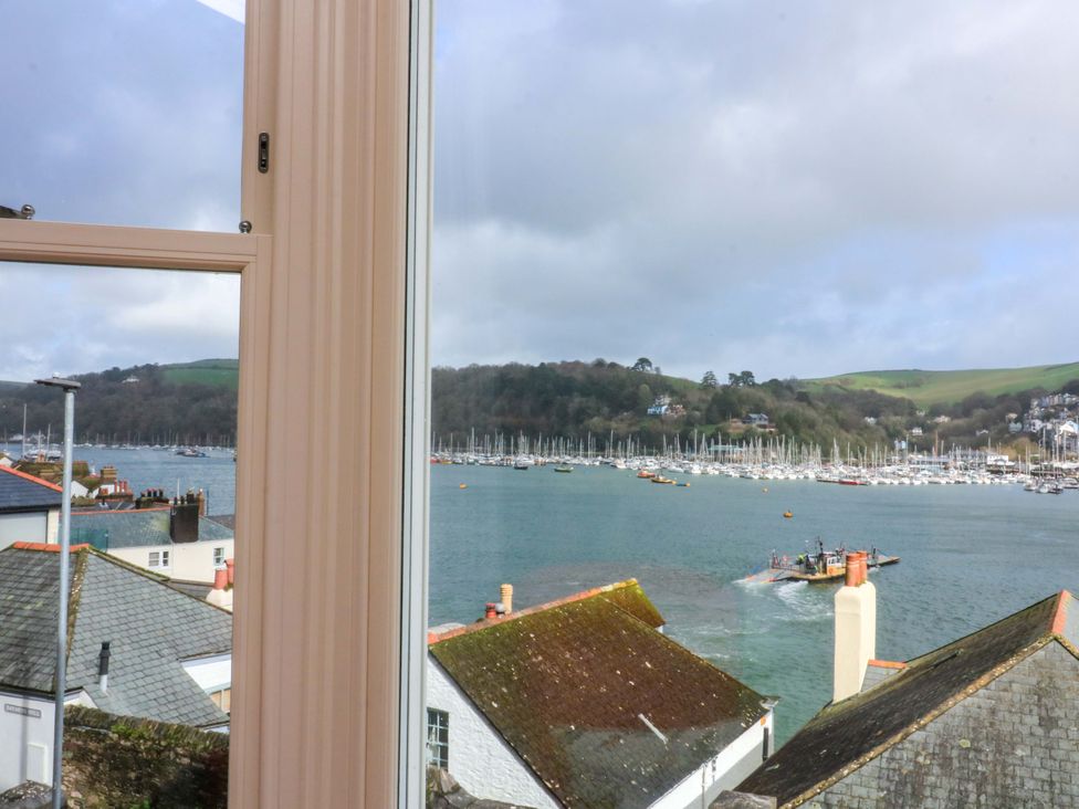 A view of a marina with boats and hills at 3 Dartview in Dartmouth